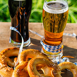Image of beer in glasses a pretzels during Laramie Brewfest
