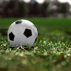 Image of soccer ball on field, ready for the game