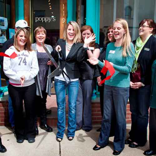 Image of ribbon-cutting ceremony in front of a business in Laramie, WY